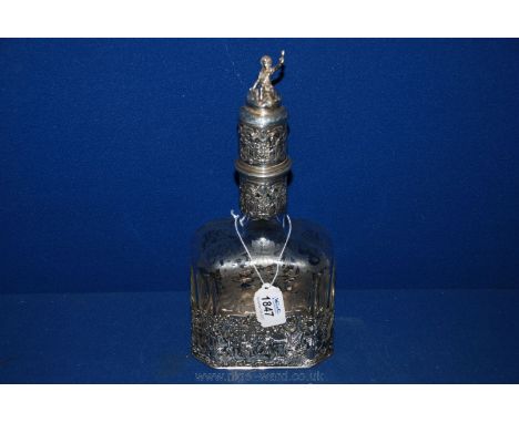 An early Continental engraved Glass Decanter with corked stopper, sitting in a very decorative pierced Silver base and having