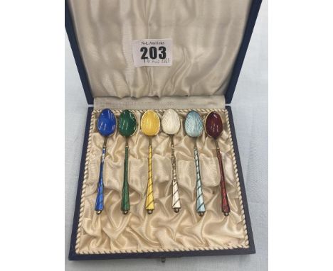 A boxed set of six Silver and enamel teaspoons