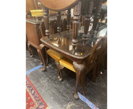 A Walnut dining room suite; table, six chairs and a buffet/ sideboard, possible Archie Shine