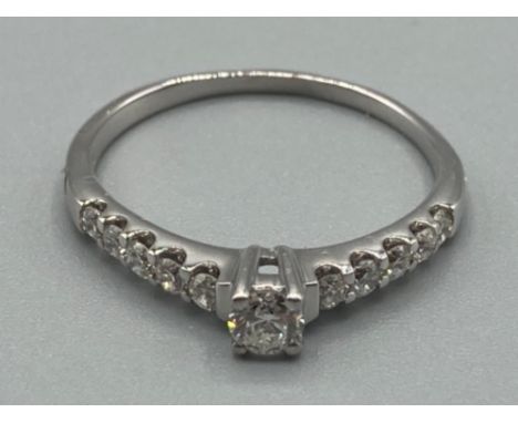 Ladies 18ct white gold diamond ring with five diamonds set on each shoulder size Q 2.5g gross