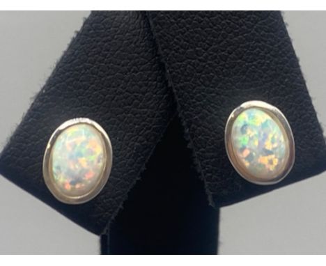 A pair of silver and opal stud earrings, 1.1g