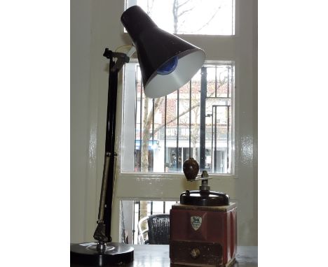 A vintage Peugeot tinplate and bakelite coffee grinder and an angelpoise lamp.