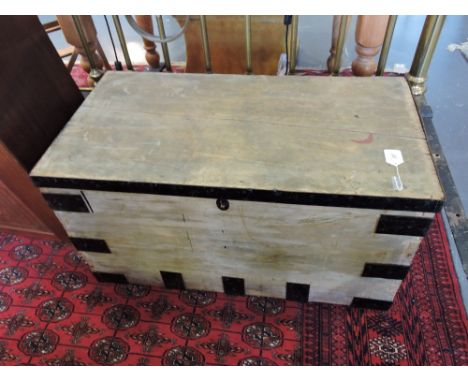 An early 20th Century iron bound pine trunk.
