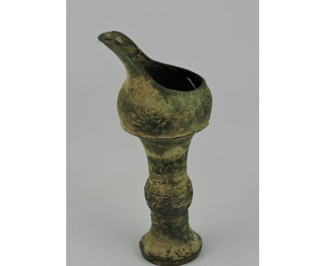 A Han Dynasty style cast metal oil lamp, H. 20.5cm.
