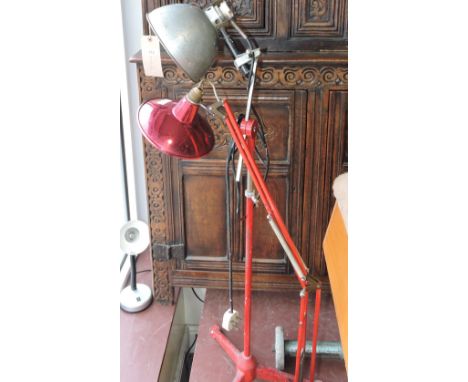 An industrial style cast iron and aluminium adjustable floor lamp and an Anglepoise style table lamp.