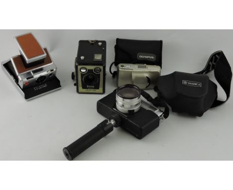 A Yashica 35mm camera, together with a Polaroid camera, and two others, (4)