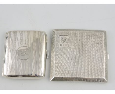 A silver square cigarette case, Birmingham 1927,engine -turned decoration with Greek Key band; together with another silver c