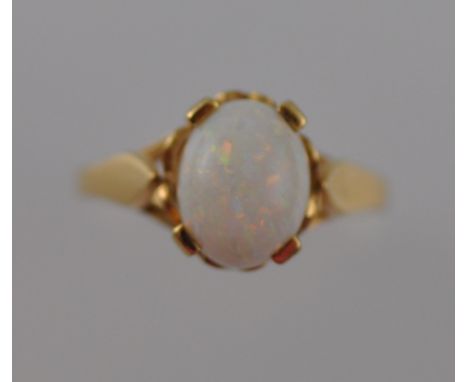 An opal dress ring, claw set in a 9ct gold band, 2.5g.