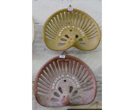 Pair of Cast Iron Tractor Seats, inscribed “Walter A Wood”, Hoosick Falls, N.Y. USA, painted brown (2)