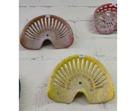 Pair of Cast Iron Tractor Seats, stamped “Pierces” Wexford, 1 painted yellow, 1 painted brown (2)