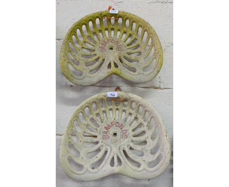 Pair of Cast Iron Tractor Seats stamped “Bamfords” painted brown with red lettering (2)