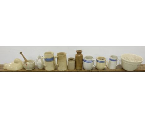Shelf of ceramic ware – Irish Carrigaline jugs, pestle with mortar, ink bottle, pudding bowl.