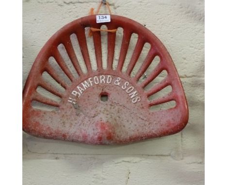 Cast Iron Tractor Seat stamped “Bamford & Sons” number 24, painted red (1)