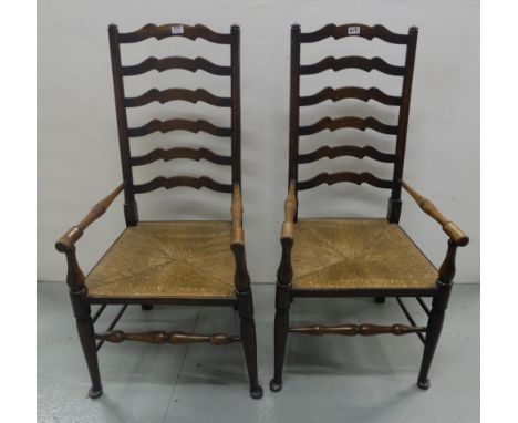 Matching pair of Oak Ladder Back Armchairs, with rush seats