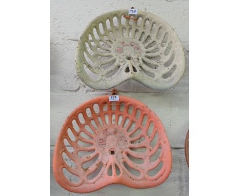 Pair of Cast Iron Tractor Seats, inscribed “W.E. Co. Ltd”, painted red and cream (2)