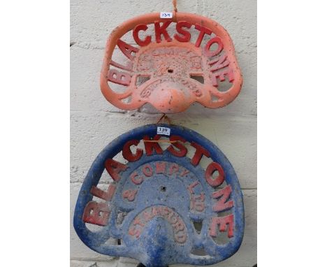 Pair of Cast Iron Tractor Seats, inscribed “Blackstone” & Co., Ltd Stamford, painted red and blue (2)