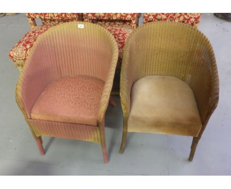 Two Lloyd Loom Armchairs, with padded seats, gold and light red colours.
