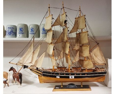 A Model Ship, a Rigged Model of the Cutty Sark. 32ins high x 27ins wide.