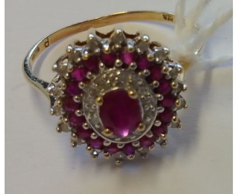 A 9ct Diamond and Ruby Cluster Ring.