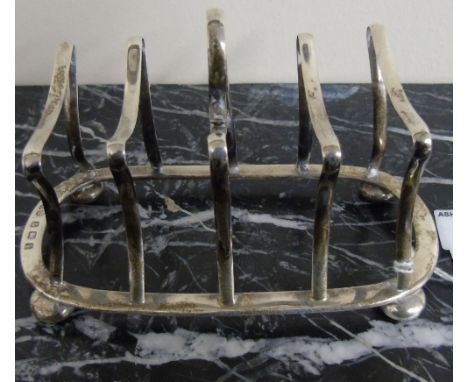 A Good Hall marked Silver Art Deco Style Toast Rack, standing on bun feet. 