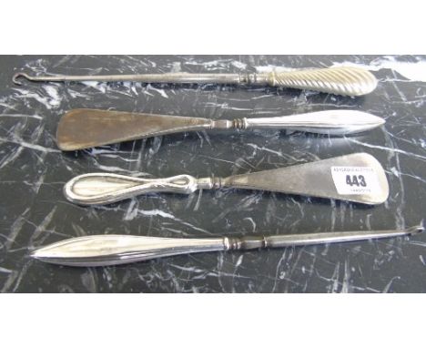 A Silver Handled Button Hook and Shoe Horn with Enamel Panels, along with another shoe horn and button hook, (4).
