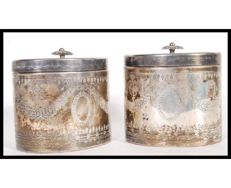 A matching pair of 20th Century Edwardian style tea caddies, of oval form having floral engraved decoration and decorative fi
