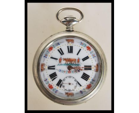 An early 20th century nickel cased enamel decorated plough dial being open faced with roman numeral chapter ring.&nbsp; Crown