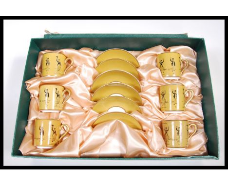 A rare Holland &amp; Holland gunsmiths promotional advertising porcelain cased tea service. The set comprising 6 coffee cans 