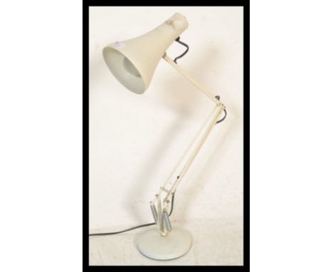 A vintage 20th Century Herbert Terry anglepoise desk lamp, raised on a circular base and fitted with conical shade, stamped H