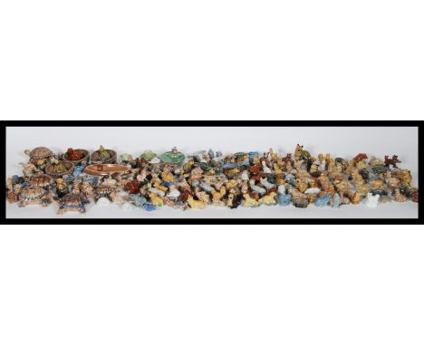 A large collection of vintage ceramic Wade whimsies to include tortoises, dogs, lions, owls, armadillo's, walrus's and many o