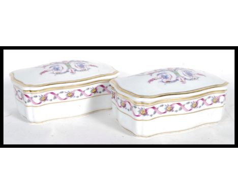 A matching pair of 20th Century ceramic trinket boxes by Richard Ginori- Pittoria, having scroll and floral decoration throug