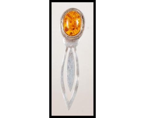 A stamped 925 silver bookmark having an amber cabochon finial. Weight 7.5g.Measures 8cm wide.