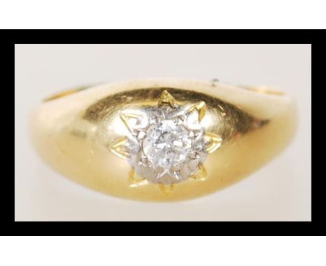 A hallmarked 18ct gold ring gypsy set with a brilliant cut diamond to the head. Hallmarked 1969. Estimated diamond size appro