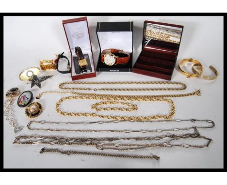 A collection of vintage costume jewellery to include a ceramic Limoges brooch, a rolled gold hinged bangle, a selection of ch