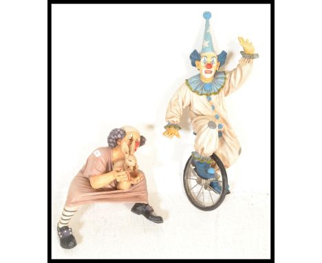 Jun Asilo - A pair of 1990's retro vintage large polyresin clown model sculptures / statues to include; clown on a unicycle a