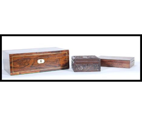 A selection of wooden boxes to include a 19th Century writing slope box having inlaid borders with a brass escutcheon to the 