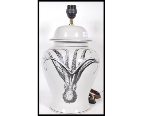 A retro 20th Century ceramic lamp of bulbous baluster form, the base decorated with octopus throughout.