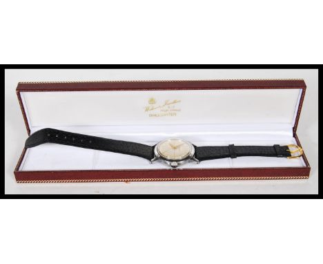 A vintage 20th Century Tissot Automatic gents wrist watch,&nbsp;silvered dial with gold coloured hands and markers, set to bl