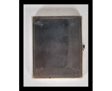 An early 20th Century silver hallmarked vesta case having an engine turned exterior with scrolled borders. Hallmarked Birming
