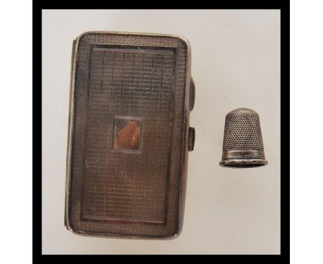 An early 20th Century silver Art Deco match vesta case of rectangular form having engine turned decoration to the exterior (h