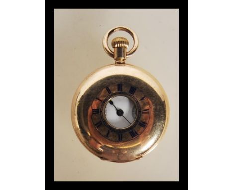 A late Victorian gold plated half hunter cased fob pocket watch being signed AM Watch Co Mass. Inscribed for 1897. Enamel hal