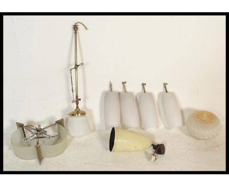 A selection of vintage and Art Deco 1930's lamp shades to include a pendant ceiling light with a frosted glass shade suspende