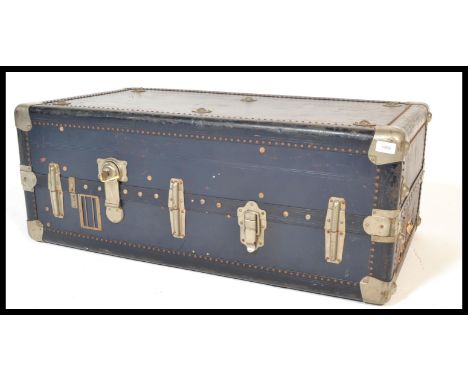 An early 20th century travelling compactum trunk by Ermette, carry handles to sides with clasps and locks to the front of the
