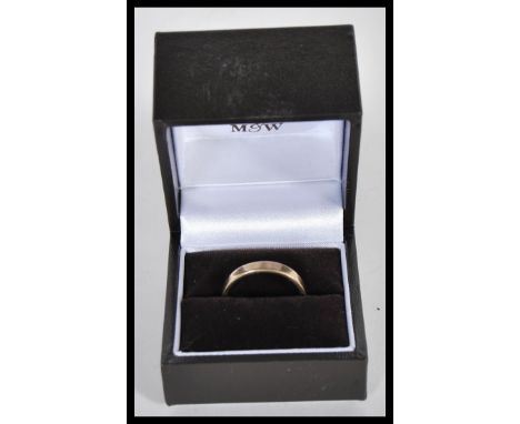 A 9ct gold bank ring being hallmarked for Birmingham. Sponsors mark CJ. Total weight 4.46g / Size R.5