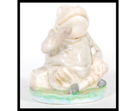 A 20th Century believed Beswick prototype ceramic figure of jeremy Fisher sitting on a lillypad. Unmarked.&nbsp; Measures 8 c