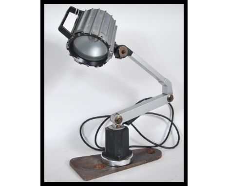 A 20th Century Retro Industrial anglepoise machine desk table lamp, having carrying handle atop and switch to back, with circ