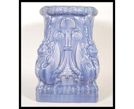 A 20th Century Art Nouveau ceramic Majolica plant stand finished in blue, having lions/ griffins to each corner, with square 