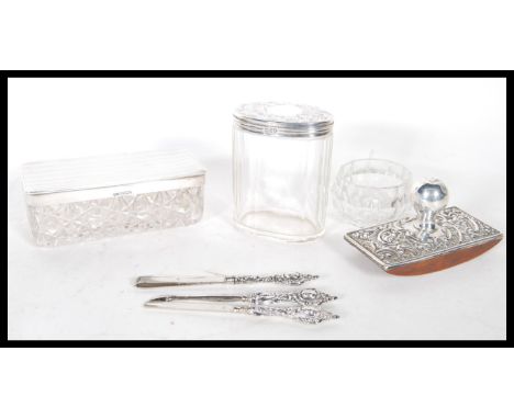 A selection of silver hallmarked dressing table items to include a Walker &amp; Hall cut glass rectangular cut glass box with