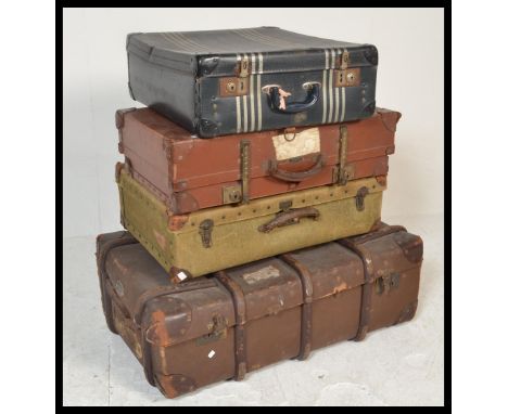 A collection of vintage steamer / travel trunks dating from the first half of the 20th Century, to include cane bound example