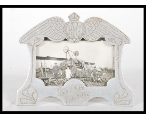 A Royal Flying Corp ( RFC ) World War 1 ( WW1 ) aluminum Trench Art easel picture frame, having chase decoration with Royal F